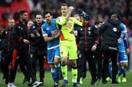 MANCHESTER, ENGLAND - MARCH 04: Charlie Daniels of AFC Bournemouth (L) celebrates with Artur Boruc of AFC Bournemouth (C) after the Premier League match between Manchester United and AFC Bournemouth at Old Trafford on March 4, 2017 in Manchester, England.  (Photo by Julian Finney/Getty Images)